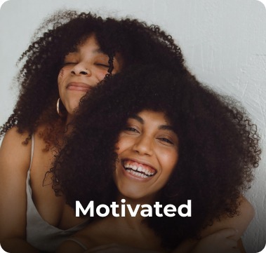 Smiling women close together – Gofrendly value of motivation and action in building friendships.